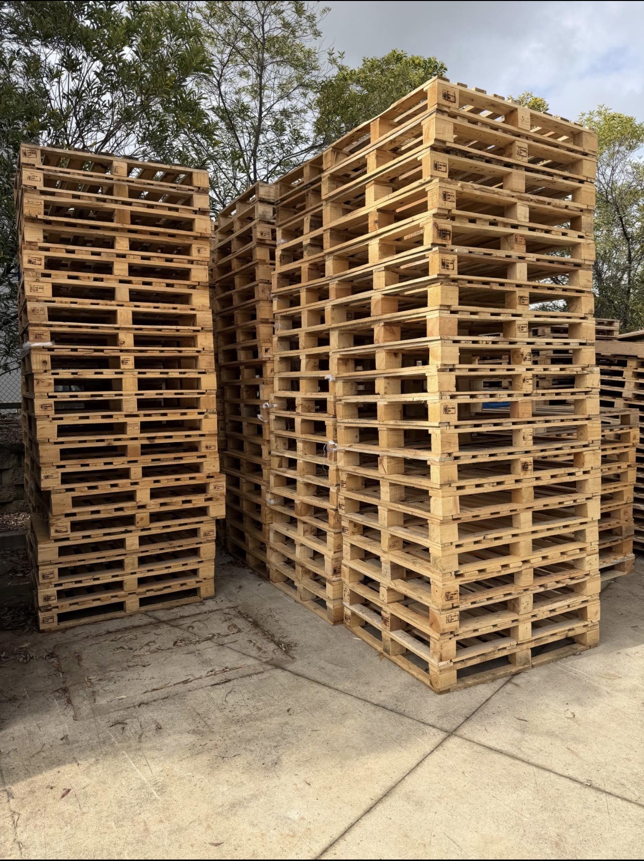 Stacked timber pallets